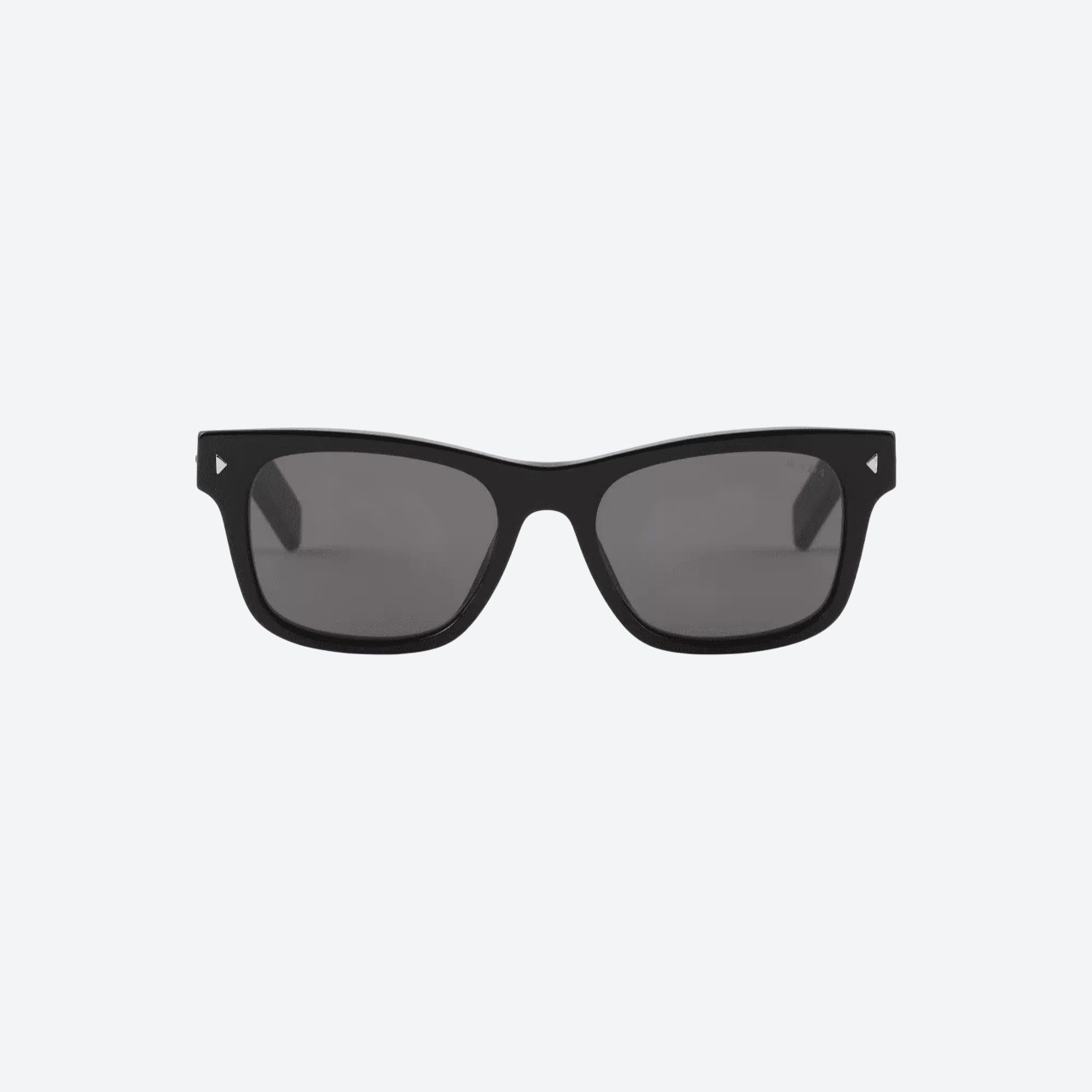 Prada sunglasses with iconic metal plaque in black lenses on model